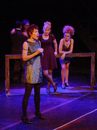 Charity (Watson) sings her soliloquy while Nikki (Maggie Allman) and Carmen (Elsbeth Strum) look on.